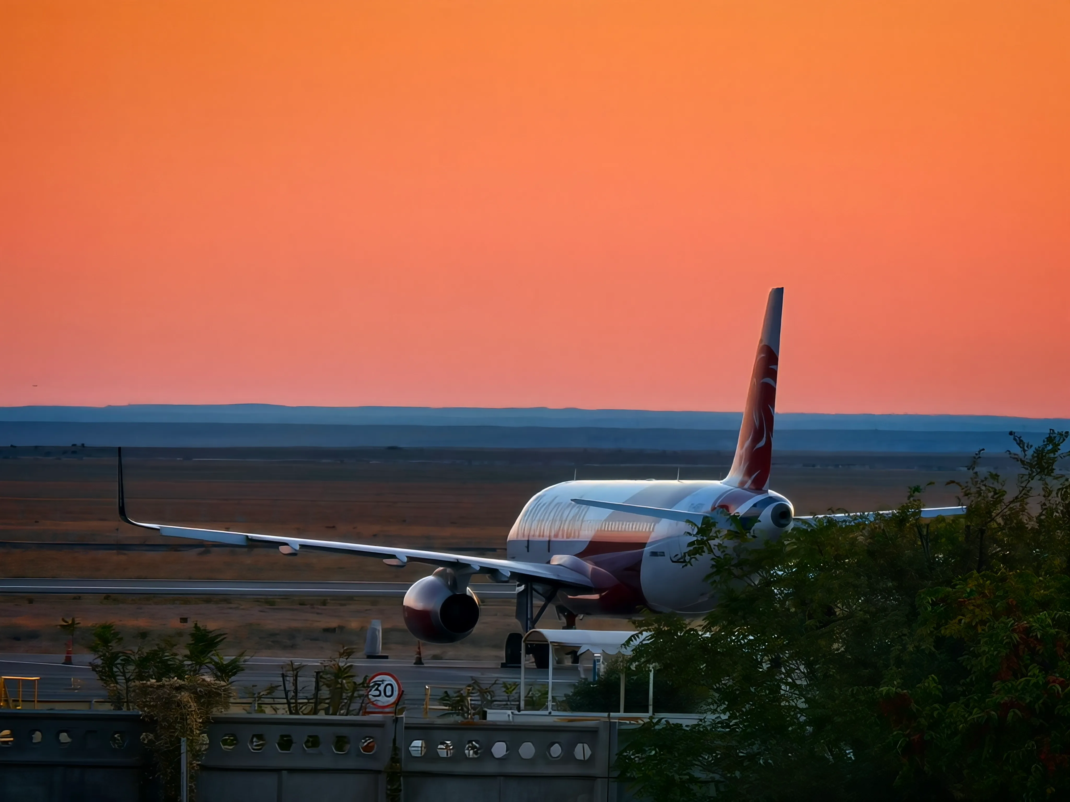 Departure plane at sunset